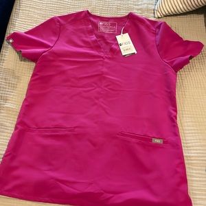 FIGS casma 3 pocket scrub top. Raspberry sorbet color.